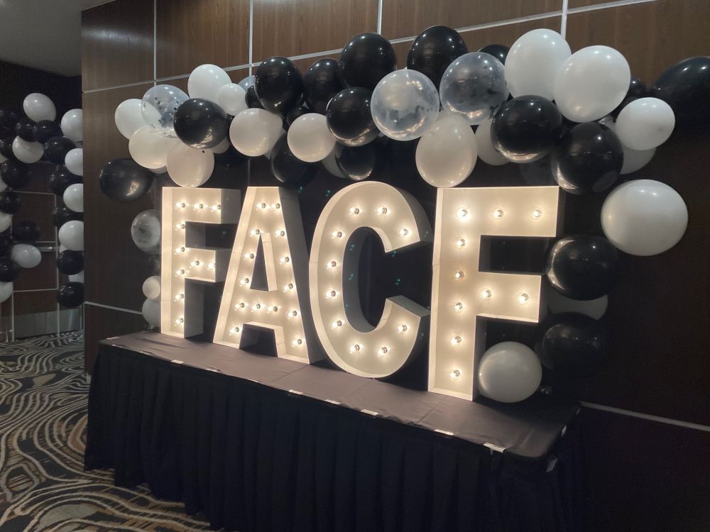 FACF marquee sign with balloons at the gala